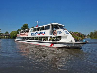 Hire a boat or take a river cruise along The Broads.