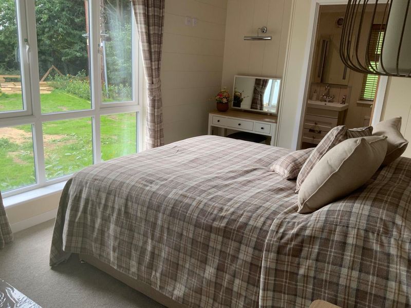 a comfy warm bedroom with ensuite facilities