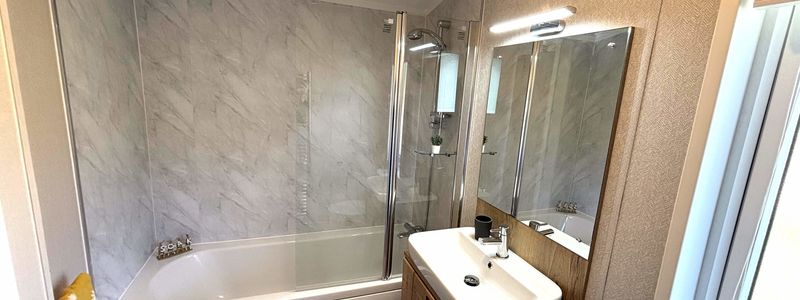 Atlas Debonair En-Suite Bath with Hand Basin and Over-Bath Shower